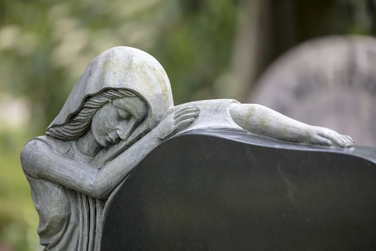 Stone angel statue in a South Wales cemetery, representing the memorial styles FR Terrazzo supplies