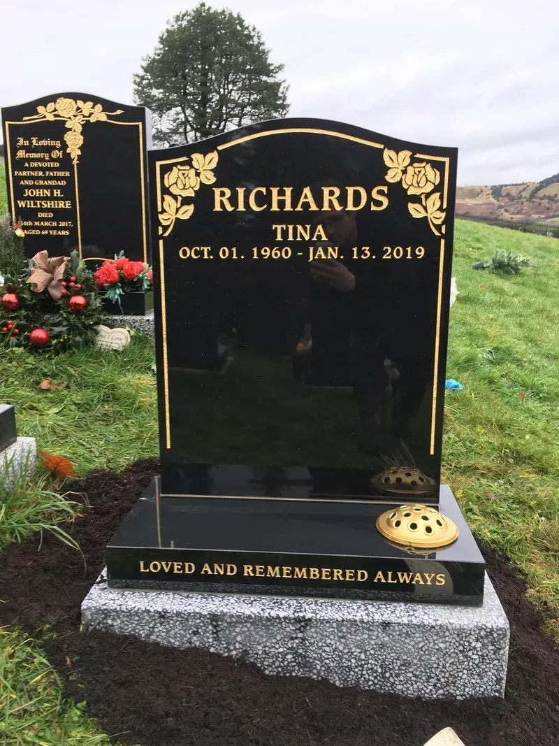 Black granite headstone with gilded roses, a raised surname panel and gold leaf inscription by FR Terrazzo, Rhondda Cynon Taff