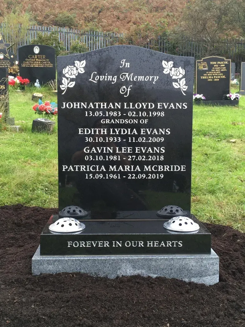 Black granite family memorial with etched roses and a gold leaf inscription on a silver grey base by FR Terrazzo, Rhondda Cynon Taff