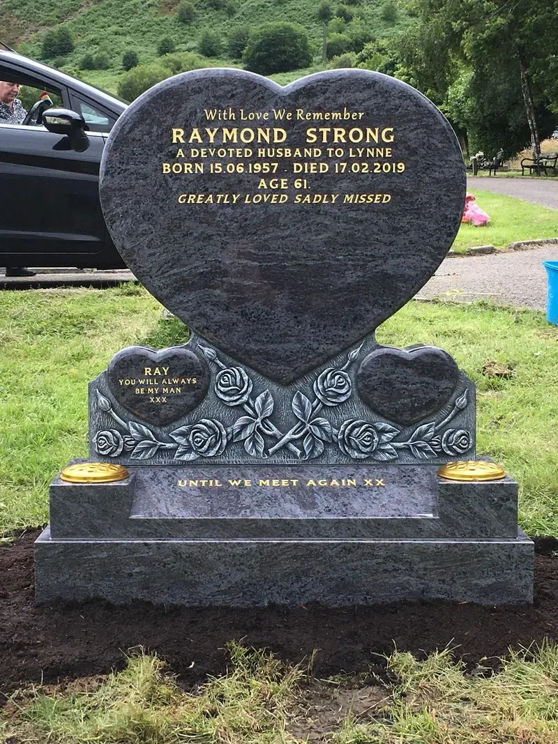 Black granite heart memorial set on a carved rose kerb base with brass flower containers by FR Terrazzo, Rhondda Cynon Taff