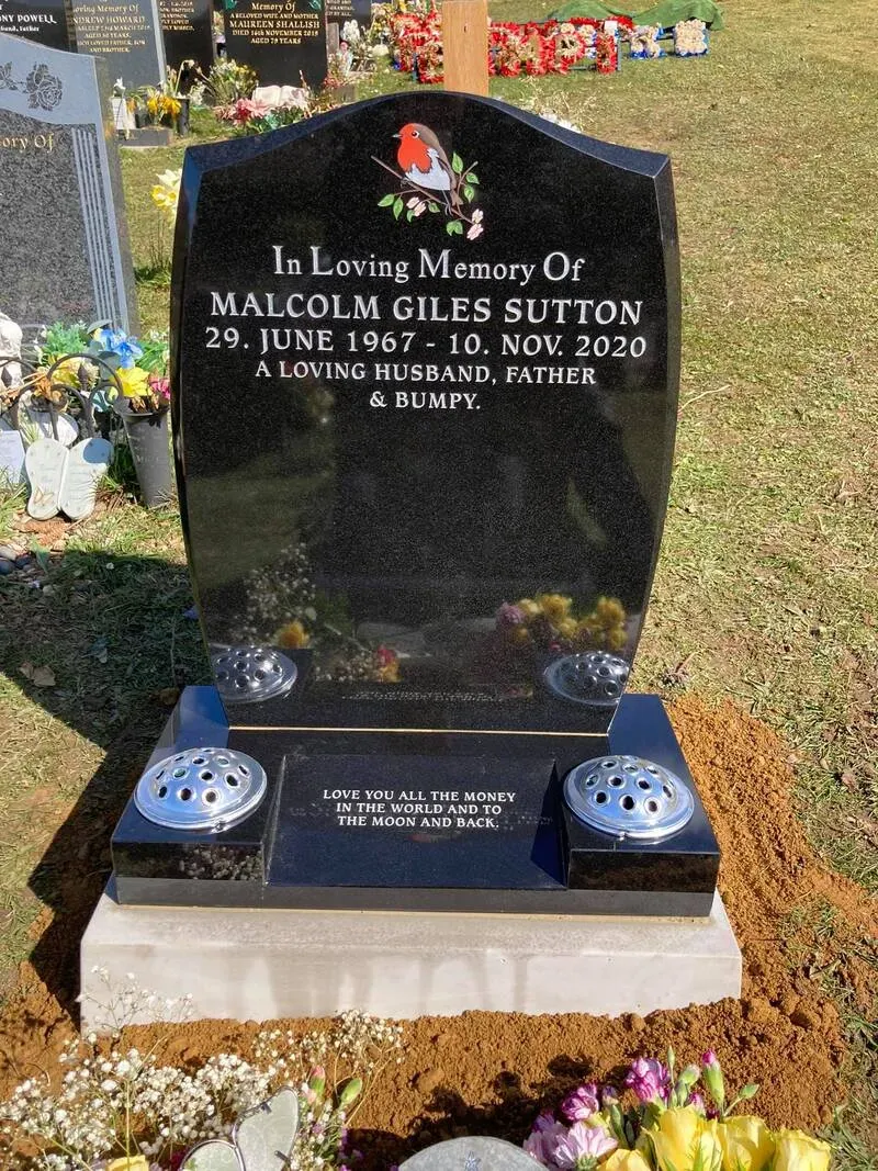 Black granite headstone with a hand-painted robin and gold leaf inscription on a polished base by FR Terrazzo, Rhondda Cynon Taff